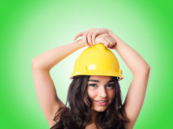 Young woman with hellow hard hat — Stock Photo, Image