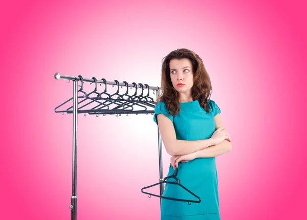 Woman trying new clothing against gradient — Stock Photo, Image