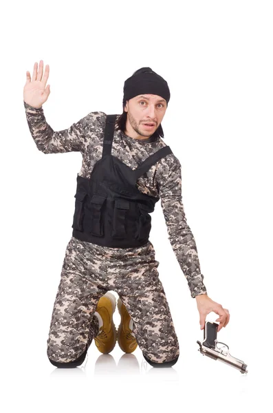 Young man in military uniform holding gun isolated on white — Stock Photo, Image