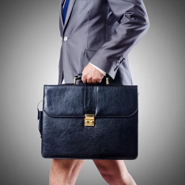 Nude businessman with briefcase against gradient — Stock Photo, Image