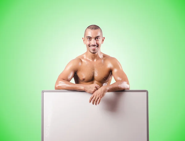 Half naked man with blank board — Stock Photo, Image