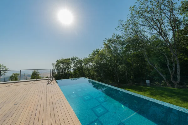 Infinity pool on the bright summer day