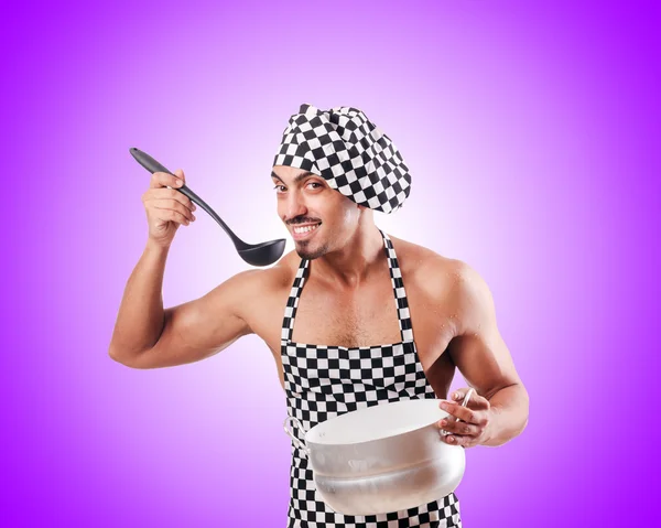 Sexy male cook against the gradient — Stock Photo, Image