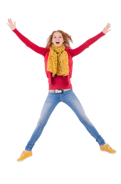 Schattig lachend meisje in rode jas en jeans geïsoleerd op wit — Stockfoto