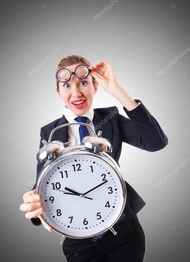 Nerd businesswoman with giant alarm clock Stock Photo Elnur 77336238