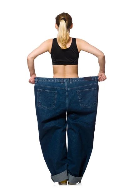 Dieting concept with big jeans — Stock Photo, Image