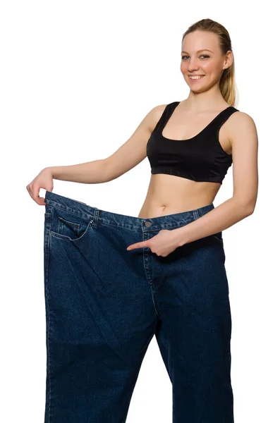 Dieting concept with big jeans — Stock Photo, Image