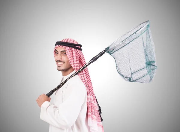 Araber forretningsmand med fangst net mod gradient - Stock-foto