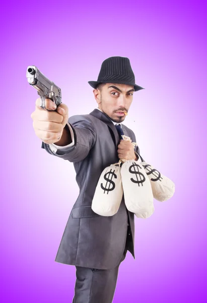 Uomo d'affari criminale con sacchi di denaro — Foto Stock