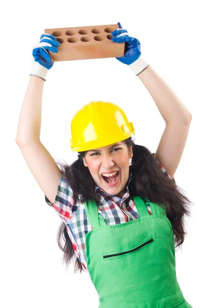 Female workman in green overalls holding brick isolated on white — Stock Photo, Image