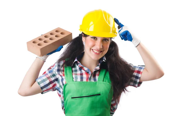 Trabalhadora feminina em macacão verde segurando tijolo isolado em branco — Fotografia de Stock