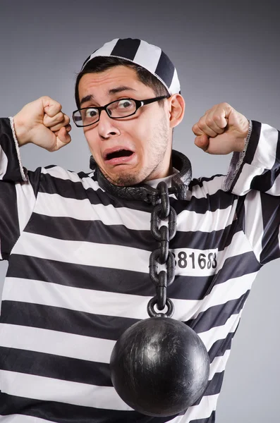 Funny prisoner in chains isolated on gray — Stock Photo, Image