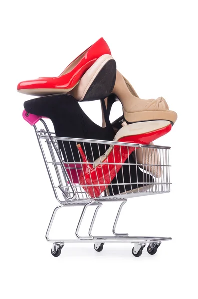 Woman shoes in shopping cart on white — Stock Photo, Image