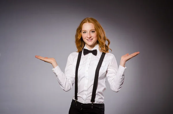 Pretty girl wearing black and white clothing isolated on gray — Stock Photo, Image