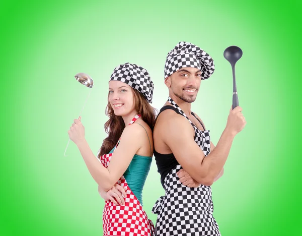 Pair of funny cooks against gradient — Stock Photo, Image