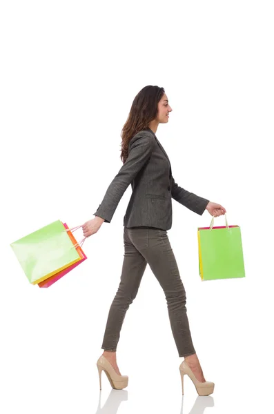 Mulher atraente com sacos de compras isolados em branco — Fotografia de Stock