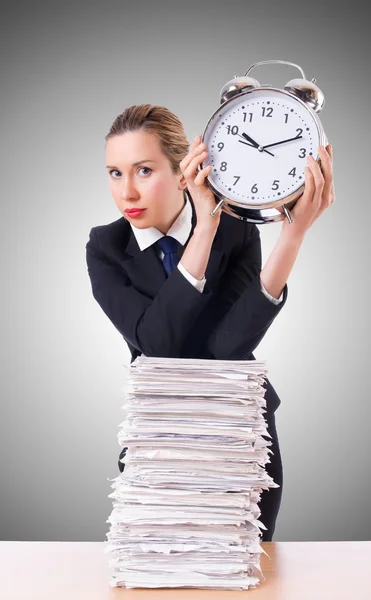 Woman businesswoman with giant alarm clock — Stock Photo, Image