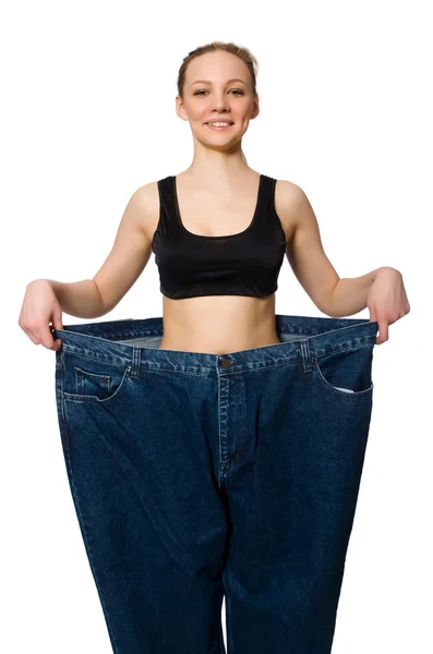 Dieting concept with big jeans — Stock Photo, Image