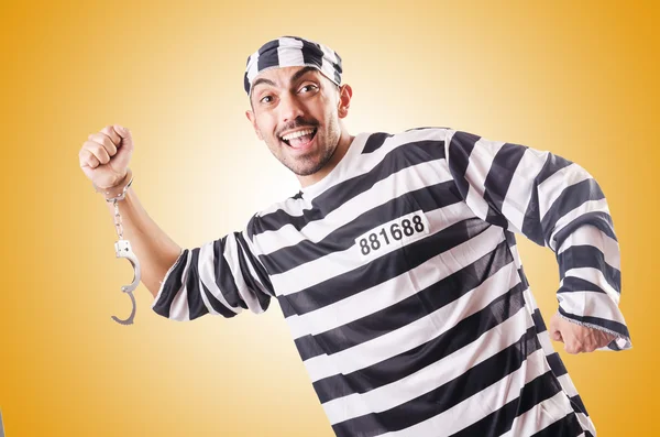 Convict criminal in striped uniform — Stock Photo, Image