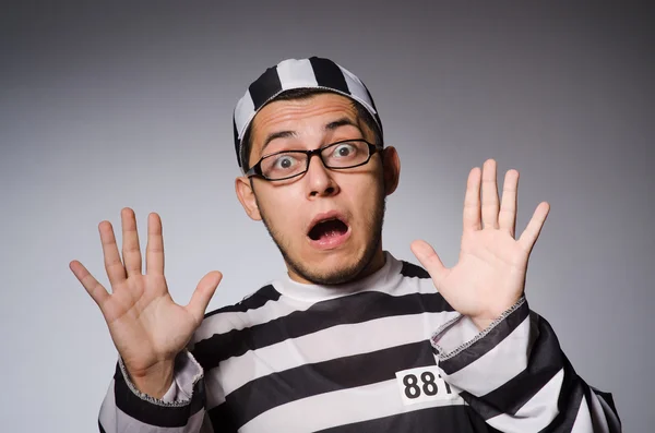 Funny prisoner isolated on gray — Stock Photo, Image