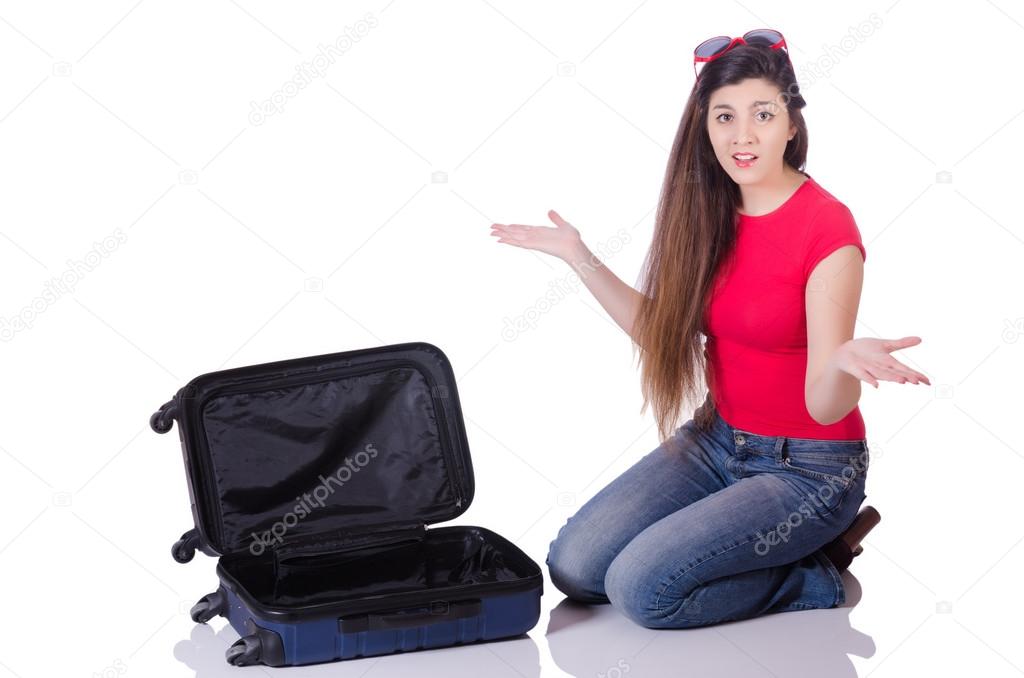 Pretty girl with suitcase isolated on white