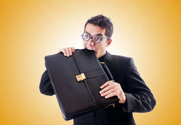 Empresario nerd comiendo su maletín —  Fotos de Stock