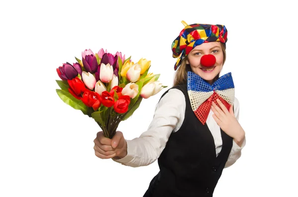 Bonito payaso femenino con flores aisladas en blanco — Foto de Stock