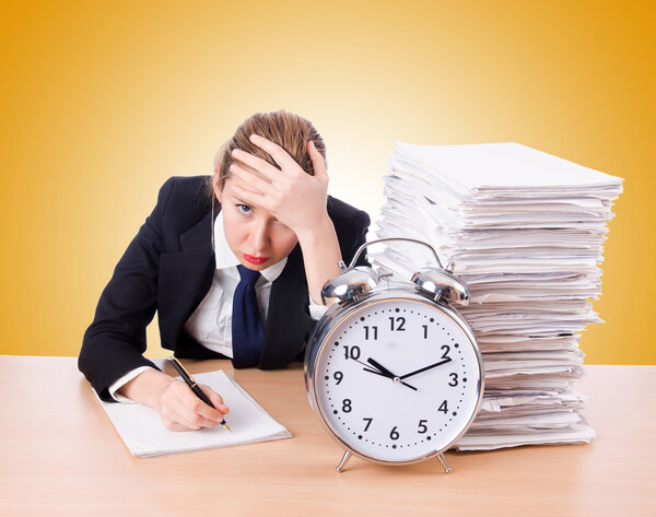 businesswoman with giant alarm clock