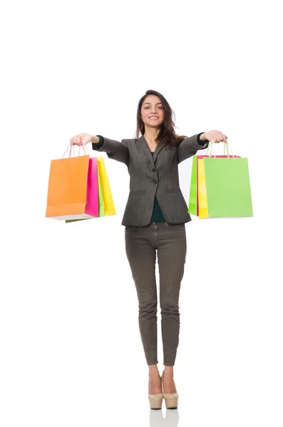 Mulher atraente com sacos de compras isolados em branco — Fotografia de Stock