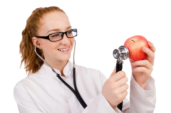 Bonita doctora con estetoscopio y manzana aislada en whit — Foto de Stock