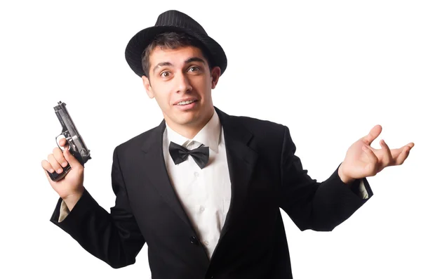 Молодой элегантный мужчина держит пистолет изолирован на белом — стоковое фото