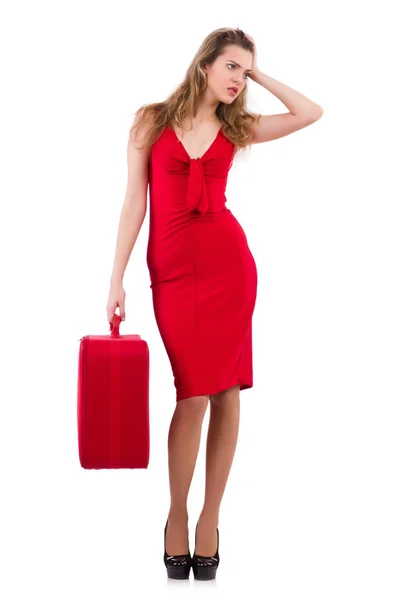 Mujer joven en vestido rojo con maleta aislada en blanco —  Fotos de Stock