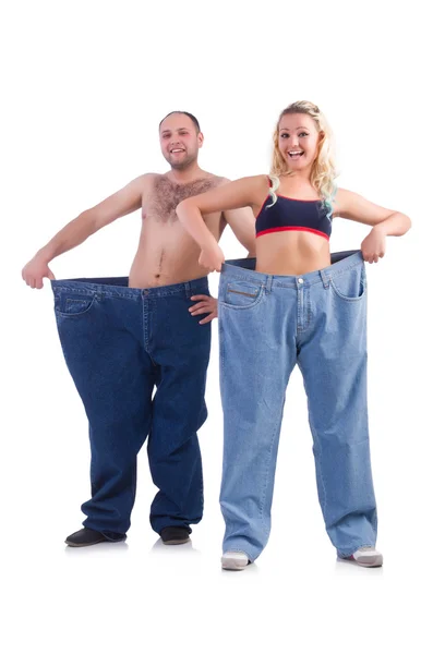 Woman and man loosing weight isolated on white — Stock Photo, Image