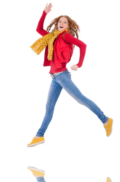 Menina sorridente bonito em casaco vermelho e jeans isolado em branco — Fotografia de Stock