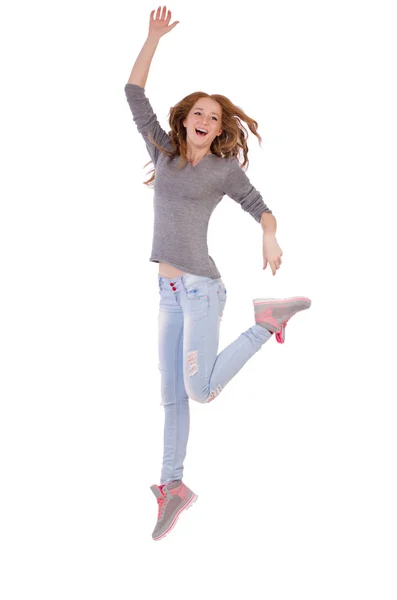Menina sorridente bonito em blusa cinza e jeans isolado em branco — Fotografia de Stock