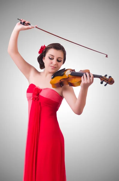 Giovane ragazza con violino contro il gradiente — Foto Stock