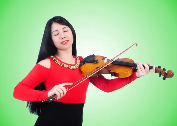 Jong meisje met viool tegen het verloop — Stockfoto