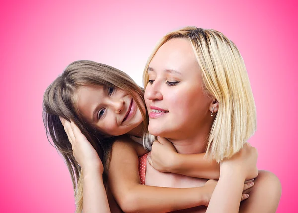 Happy mom and daughter against the gradient — Stock Photo, Image