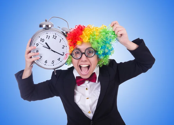 Funny clown with clock against the gradient — Stock Photo, Image