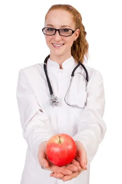 Pretty female doctor with stethoscope and apple isolated — Stock Photo, Image