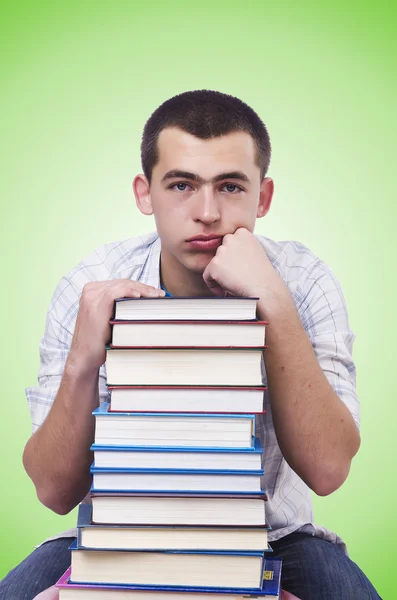 Student mit vielen Büchern über Grün — Stockfoto