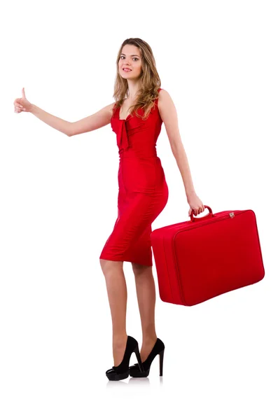 Hitchhiker woman in red dress with suitcase isolated on white — Stock Photo, Image