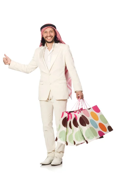 Uomo arabo con shopping bags su bianco — Foto Stock