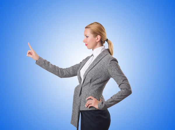 Businesswoman pressing virtual buttons — Stock Photo, Image