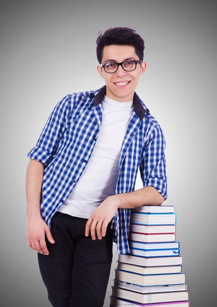 Student mit vielen Büchern — Stockfoto