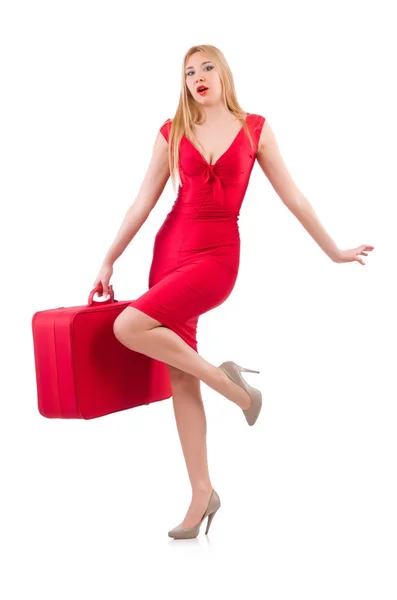Blondie i röd klänning med resväska isolerad på vit — Stockfoto