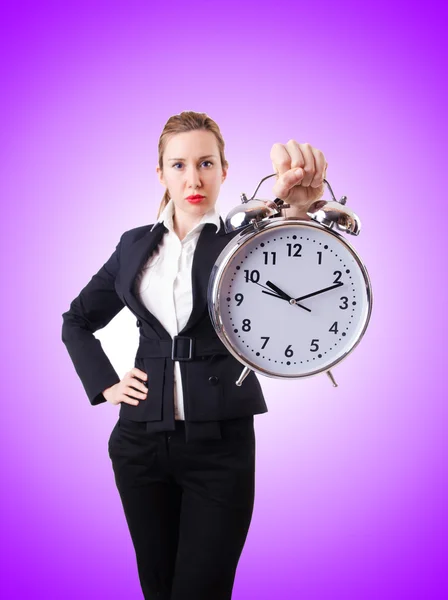 Businesswoman with giant clock — Stock Photo, Image