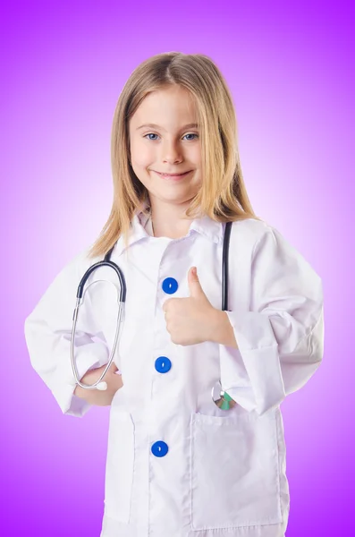 Niña con traje de médico —  Fotos de Stock