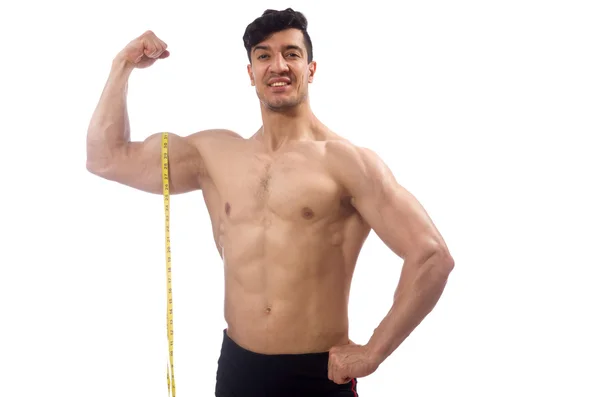 Homem muscular medindo seus músculos — Fotografia de Stock