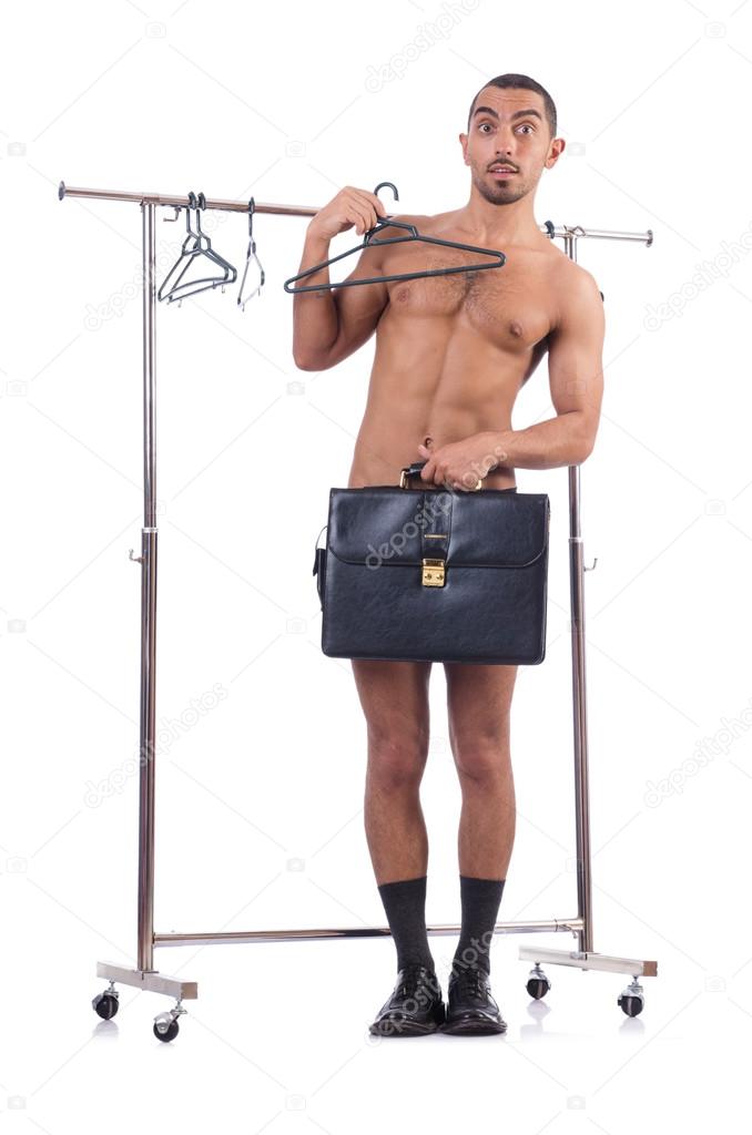 Nude man choosing clothing